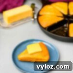 keto cornbread on a plate with butter