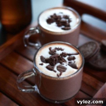Oreo hot chocolate served in two glass cups, ready to be enjoyed.