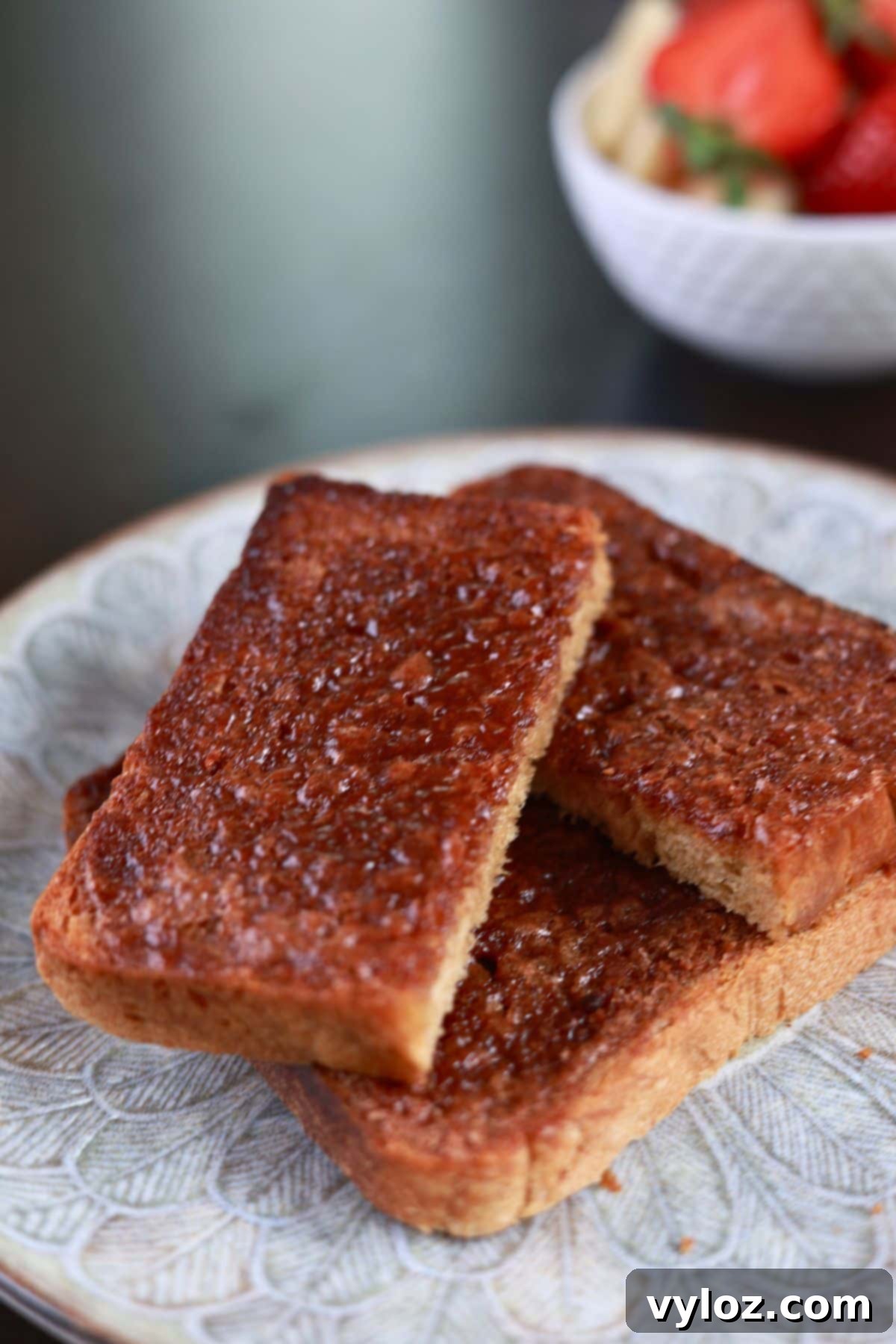 Golden Air Fryer Cinnamon Toast 5 Buttery cinnamon toast served on a plate.