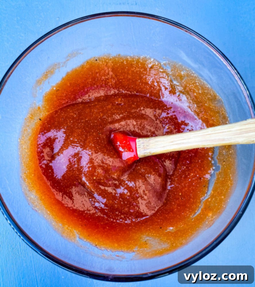 Air fryer meatloaf glaze mixed in a glass bowl.