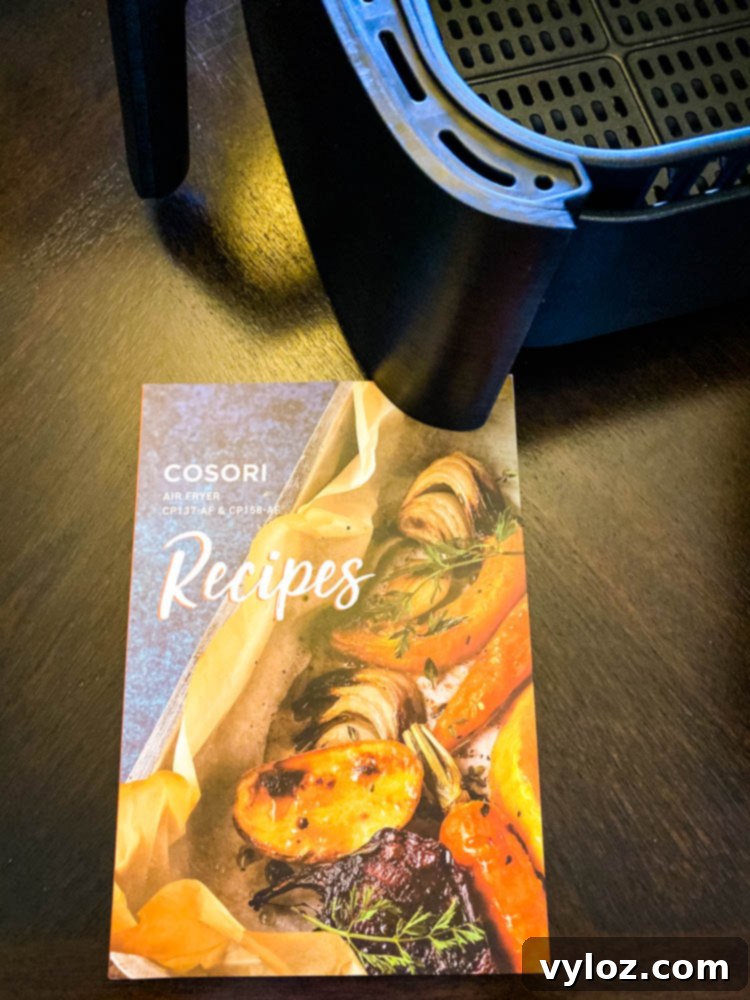 Cosori air fryer recipe book filled with 100 delicious ideas.