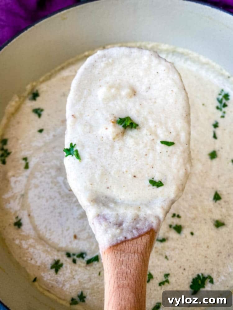 wooden spoon of keto low carb cauliflower soup