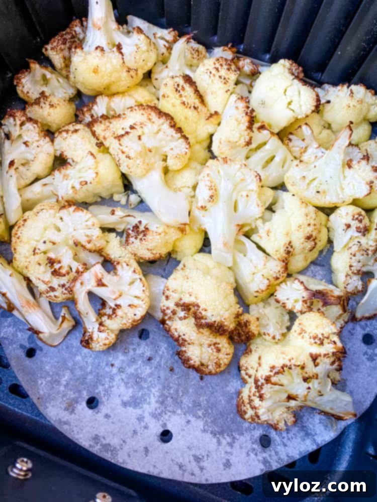 roasted cauliflower in an air fryer basket