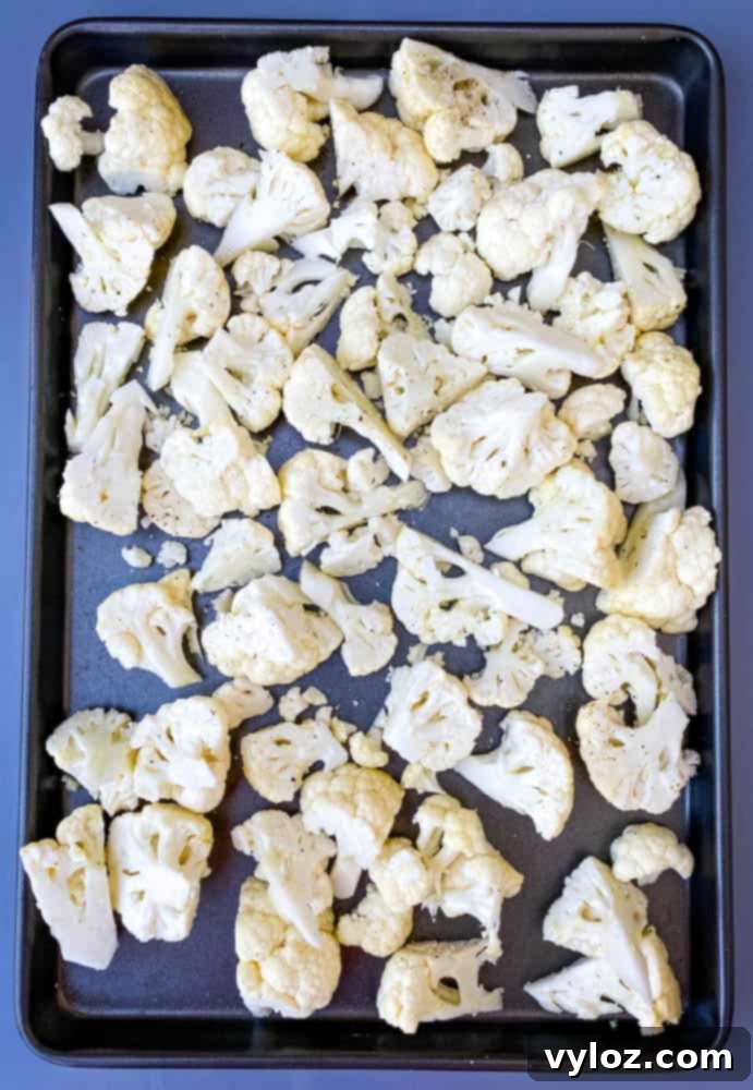 raw cauliflower on a sheet pan