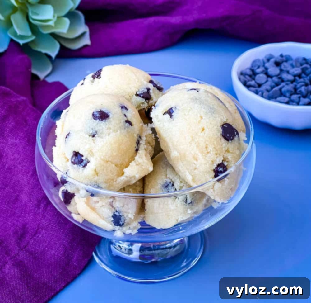 keto low carb chocolate chip cookie dough bites in a glass bowl with a purple napkin, ready to be enjoyed as a healthy, sugar-free dessert