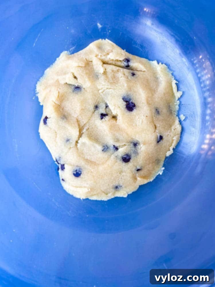 A vibrant close-up of keto low-carb cookie dough in a glass bowl, ready to be enjoyed.
