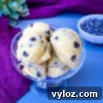 keto low carb chocolate chip cookie dough bites in a glass bowl with a purple napkin