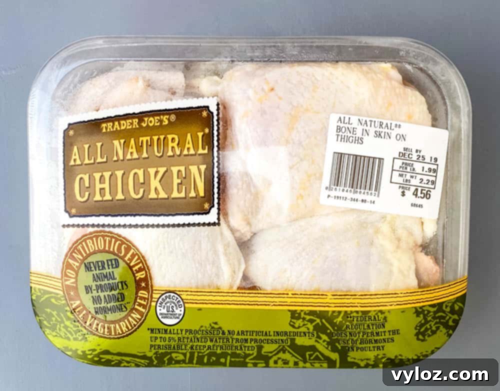 Packaging of raw bone-in chicken thighs, ready for preparation.