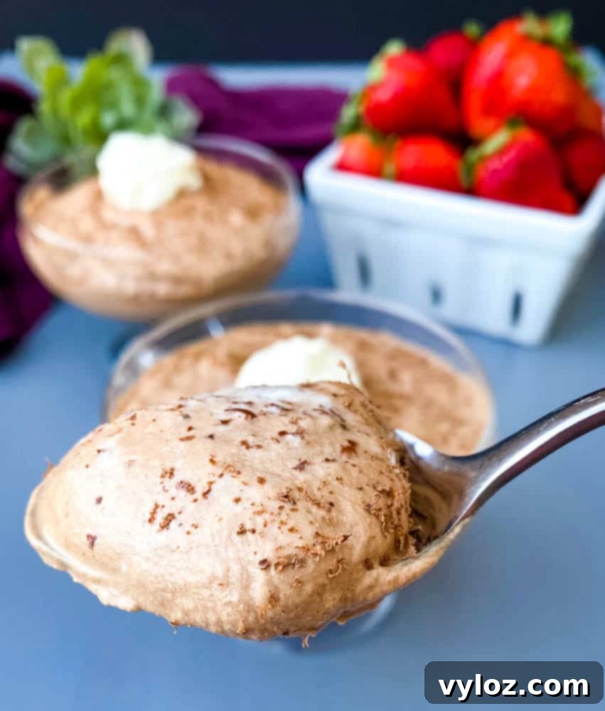 Effortless Sugar-Free Chocolate Mousse 9 Close-up of keto low carb chocolate mousse served in a small glass with a rustic wooden background