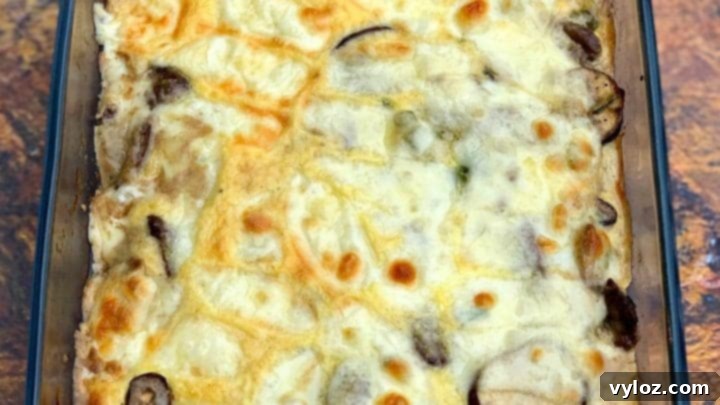 A savory keto low-carb Philly cheese steak casserole with sirloin steak, green bell peppers, mushrooms, and cream cheese.