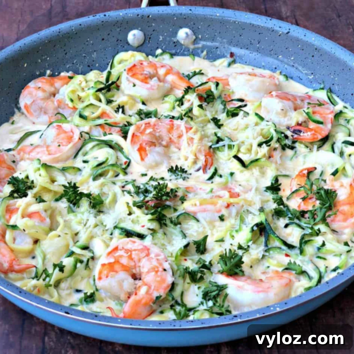 Creamy garlic shrimp alfredo served over zucchini noodles (zoodles), a quick and easy keto low-carb recipe.