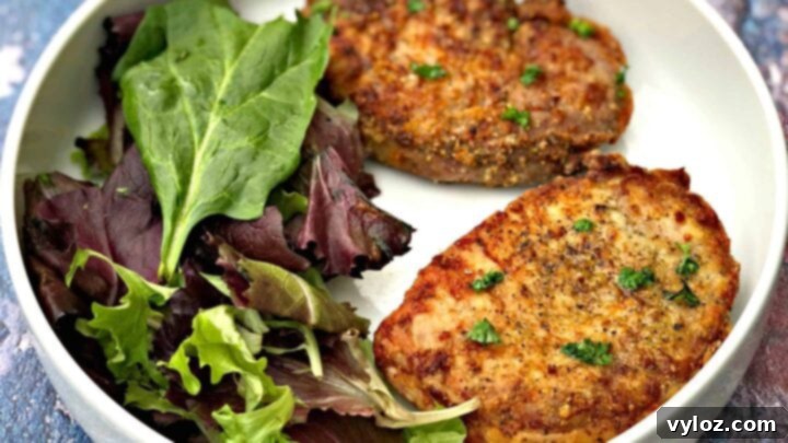 Southern-style fried pork chops cooked to crispy perfection in an air fryer, a quicker and healthier method.