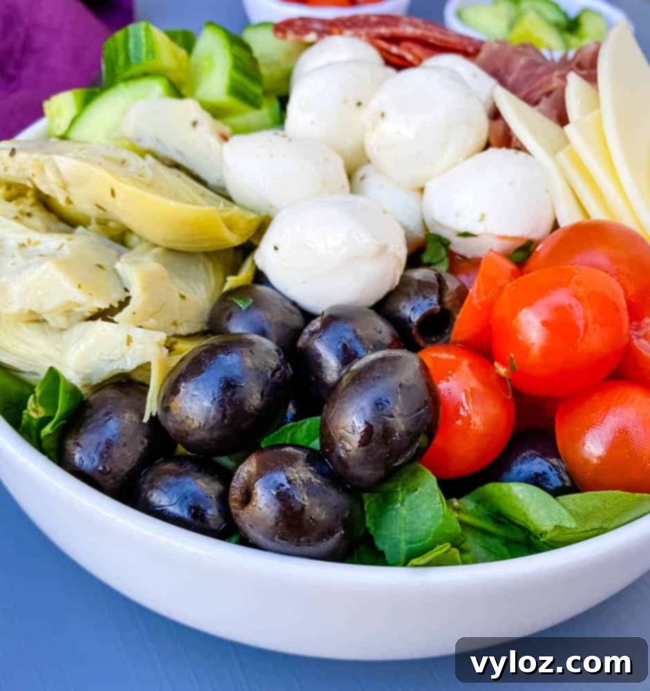 antipasto salad in a white bowl
