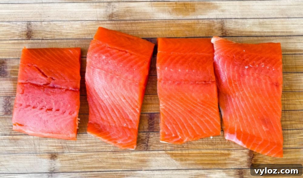 raw wild caught salmon on a cutting board
