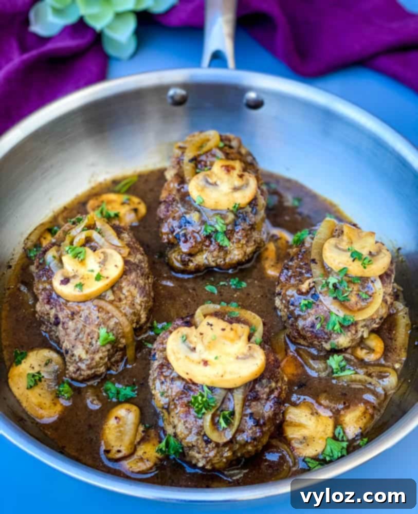 keto low carb salisbury steaks in a stainless steel pan