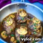 keto low carb salisbury steaks in a stainless steel pan