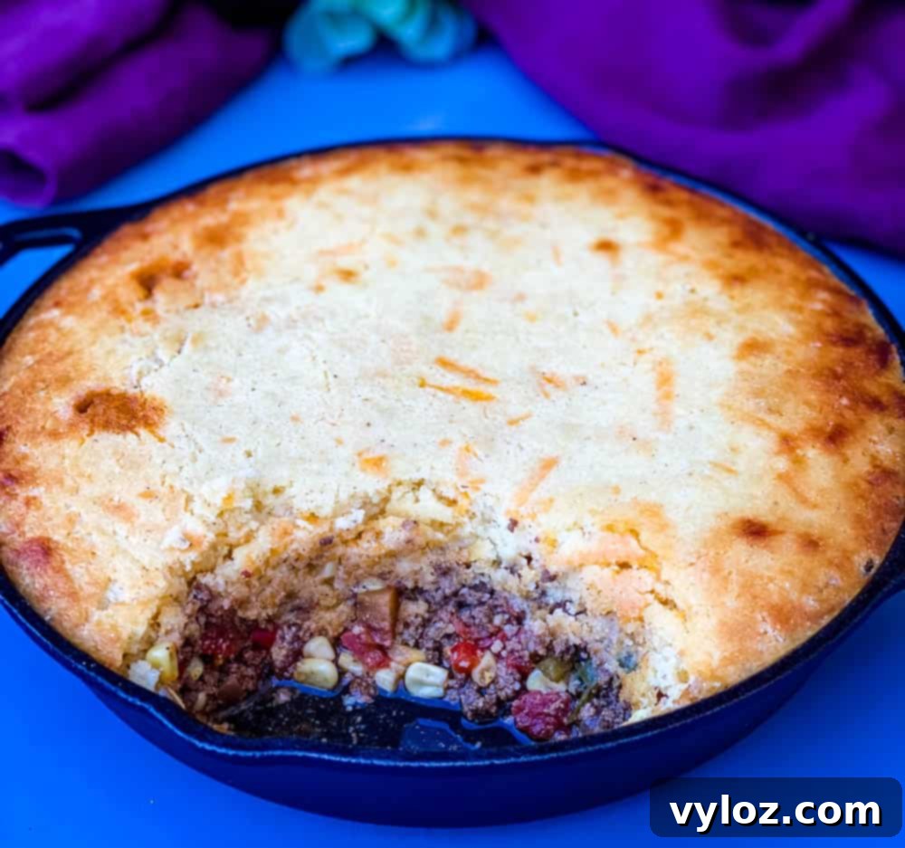 Delicious tamale pie recipe baked to perfection in a cast iron skillet, ready to serve.