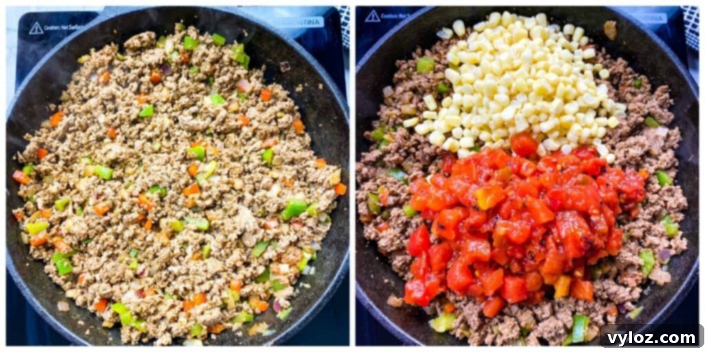 Hearty ground beef, sweet corn kernels, and diced tomatoes simmering together in a cast iron skillet, forming the casserole base.