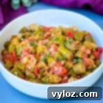 southern style stewed okra, tomatoes, and bacon in a white bowl.