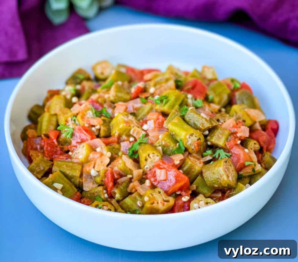 okra and stewed tomatoes in a white bowl