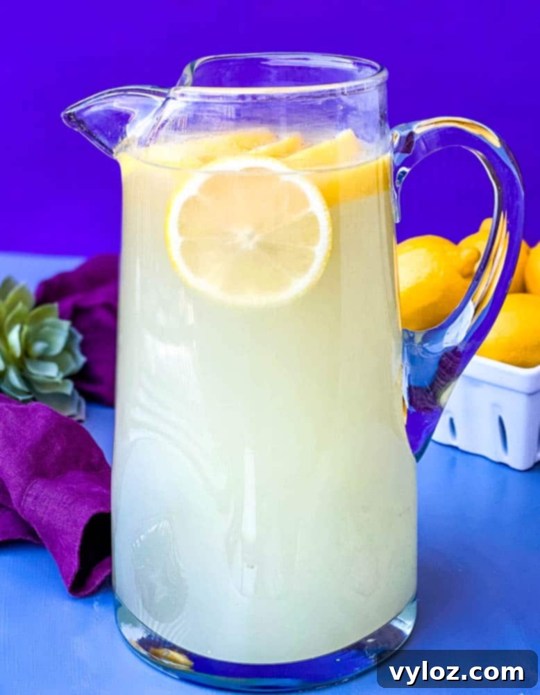 Zesty Zero Lemonade 2 keto low carb lemonade in a pitcher with fresh lemons