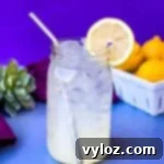 Zesty Zero Lemonade 7 keto low carb lemonade in a mason jar with fresh lemons
