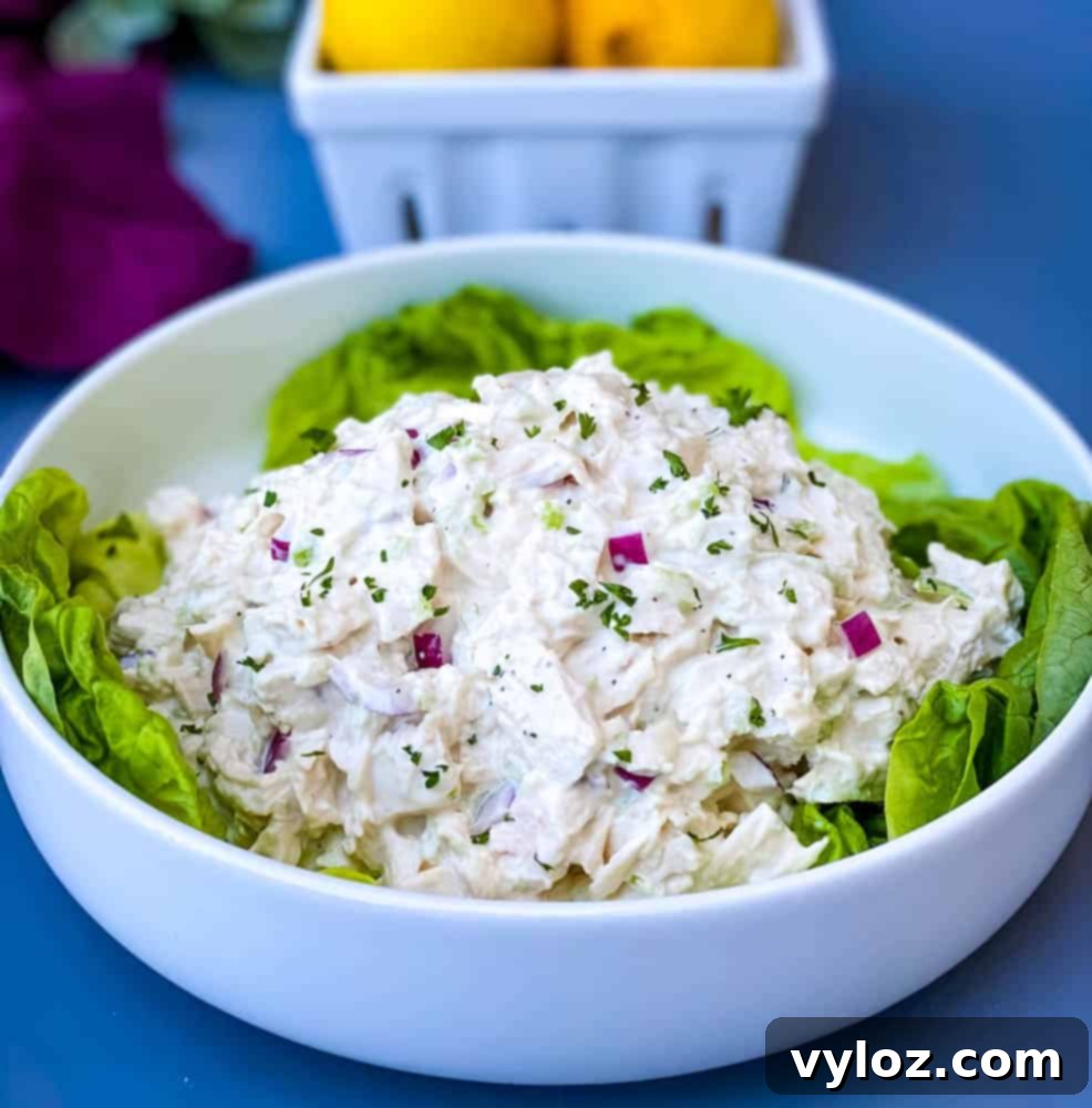 Effortless Keto Chicken Salad 2 keto chicken salad on a bed of lettuce in a white bowl