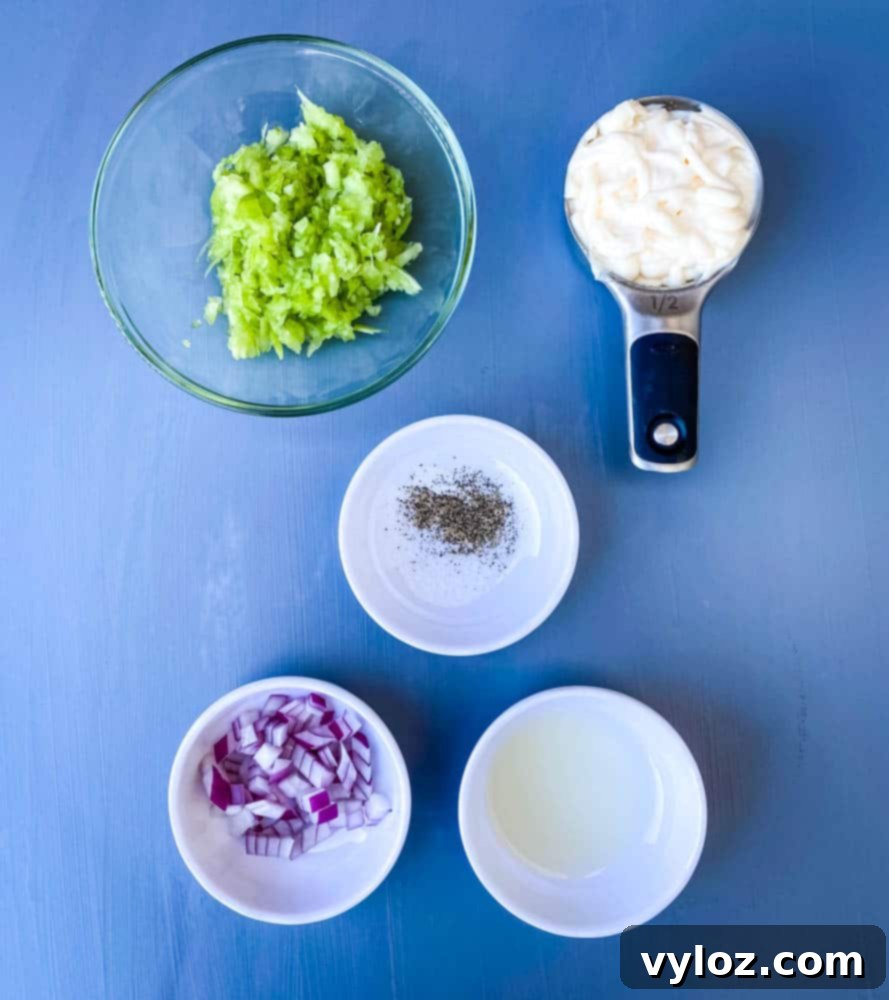 Effortless Keto Chicken Salad 3 chopped celery, chopped onions, mayo, lemon juice, and seasoning in separate bowls