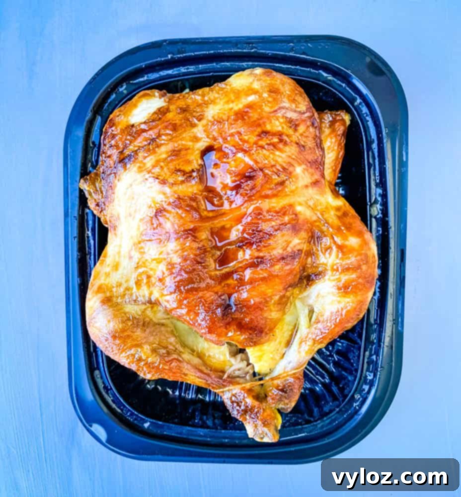 Effortless Keto Chicken Salad 4 cooked rotisserie chicken on a black plate