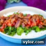 Ultimate Creamy BLT Dip 11 BLT dip with lettuce, bacon, and tomatoes in a blue serving dish