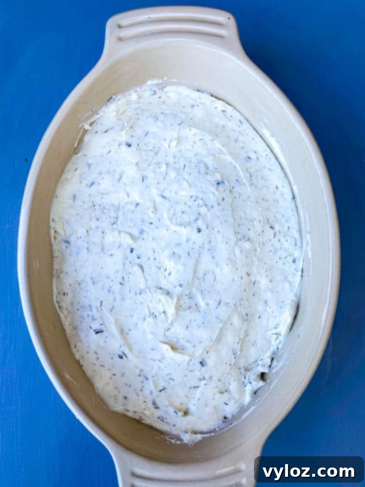 Ultimate Creamy BLT Dip 7 Creamy BLT dip with a topping of fresh ingredients, presented in an elegant serving dish.