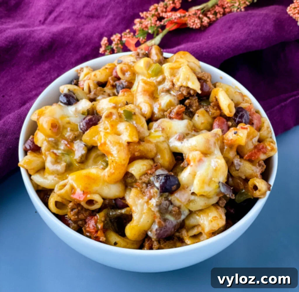 Ultimate Slow Cooker Chili Mac and Cheese 11 slow cooker chili mac and cheese in a white bowl