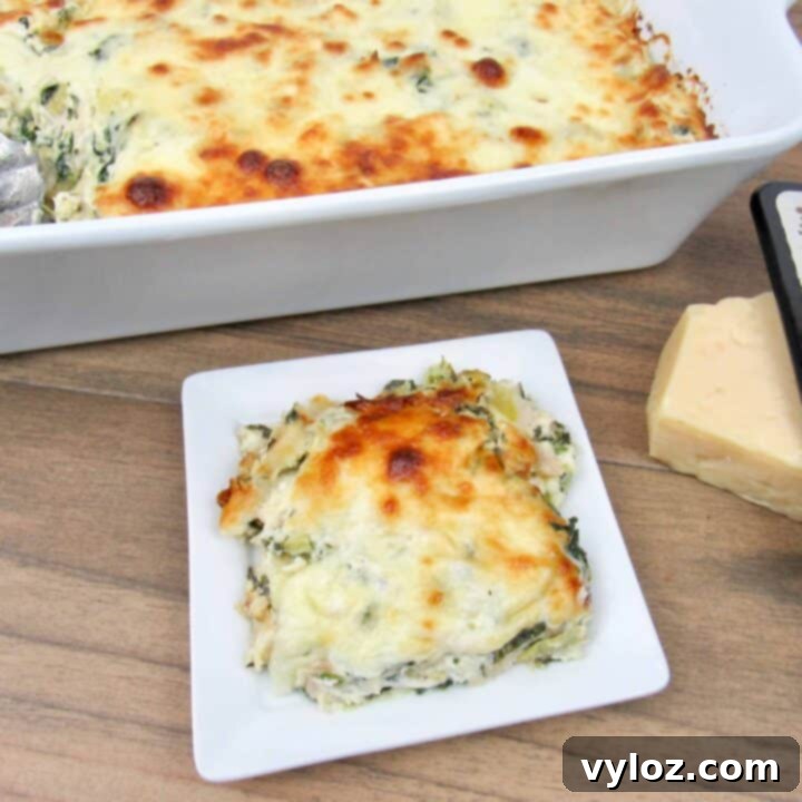 Spinach Artichoke Chicken Casserole topped with gooey mozzarella