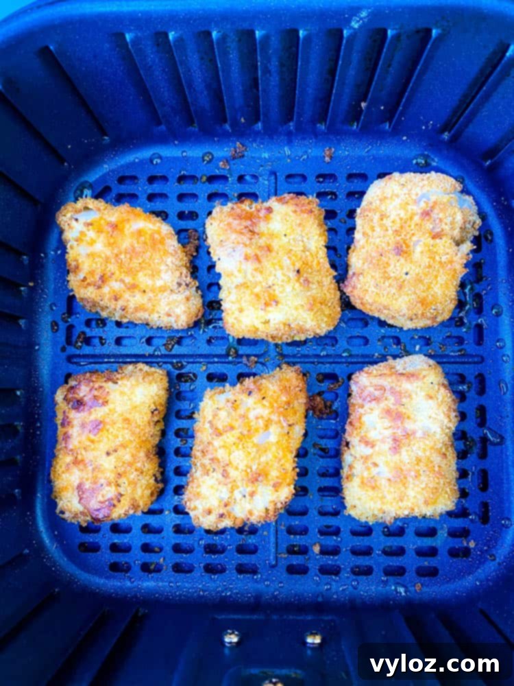 No-Fuss Air Fryer Fish 7 cooked breaded fish sticks in air fryer