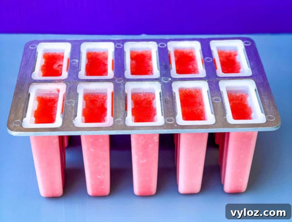 sugar free lemon strawberry mix in a popsicle mold