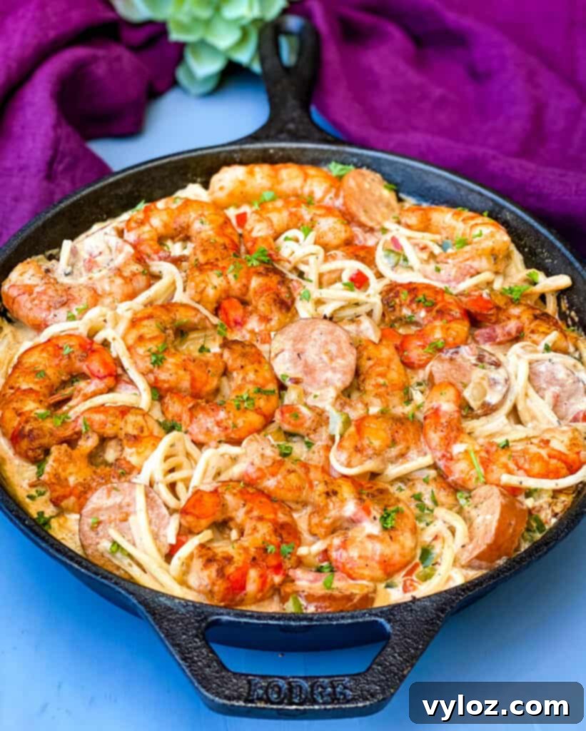 Cajun shrimp pasta prepared with low carb Palmini linguine, served in a cast iron skillet
