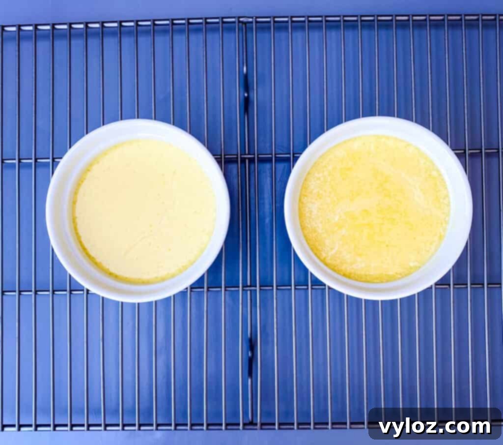 Effortless Keto Crème Brûlée 7 Keto low-carb crème brûlée custard mixture cooling on a rack after baking, still in white ramekins