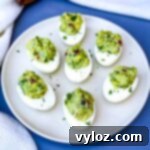 avocado deviled eggs on a white plate