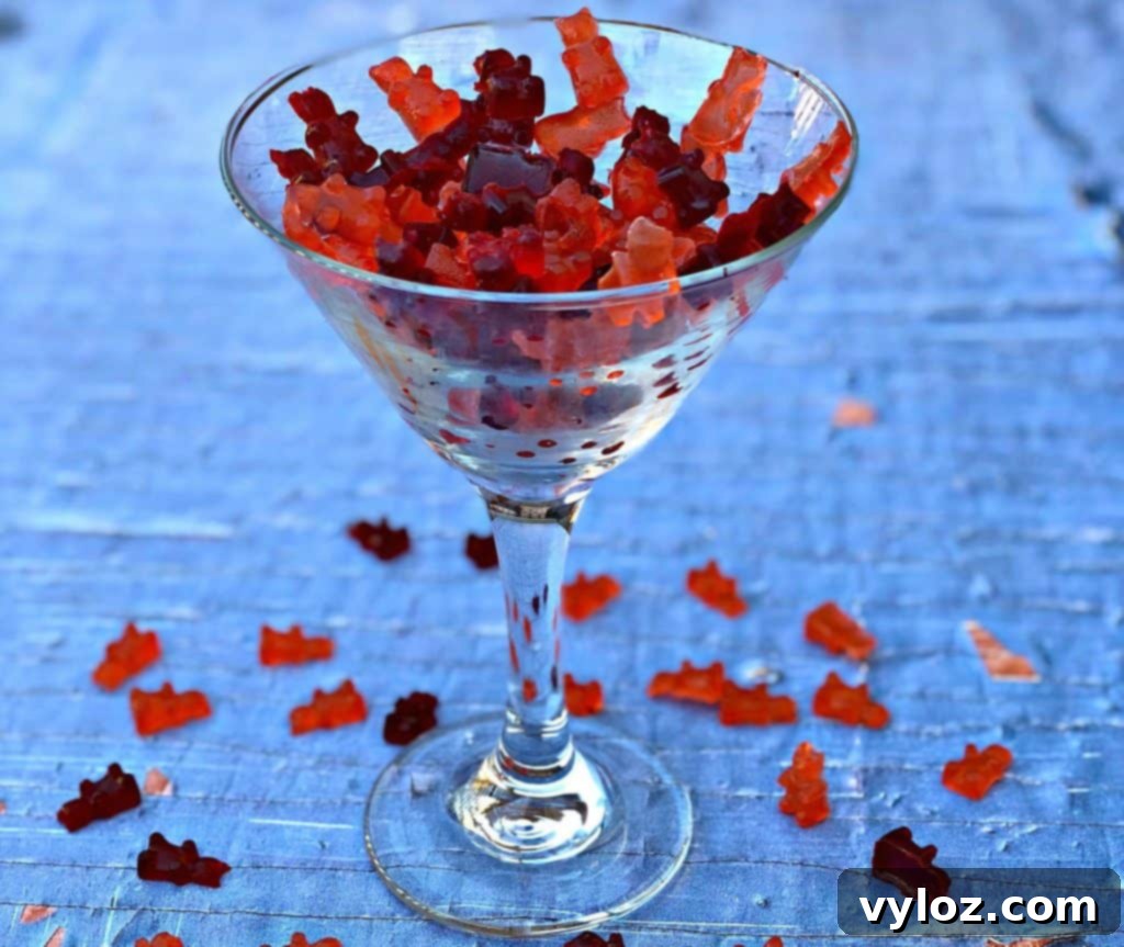 Another view of vibrant vodka gummy bears in a glass, showcasing variety