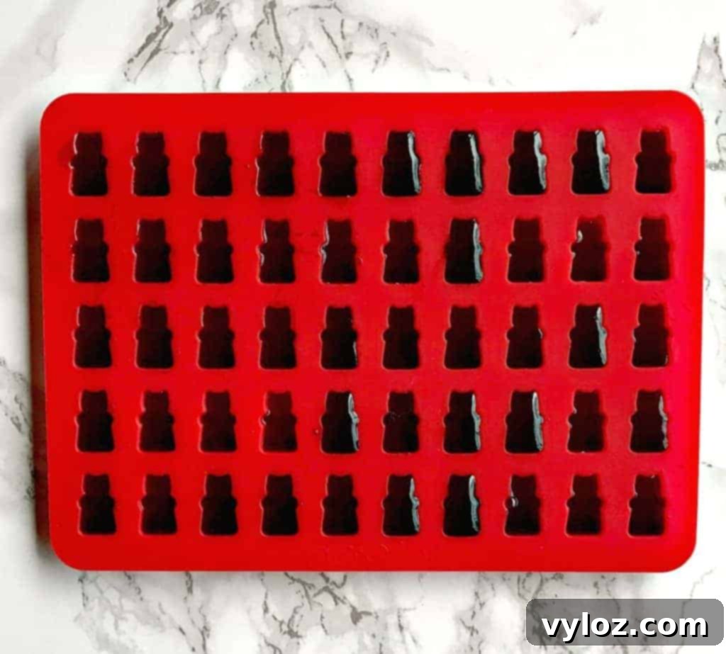 Freshly molded wine gummy bears cooling in the refrigerator