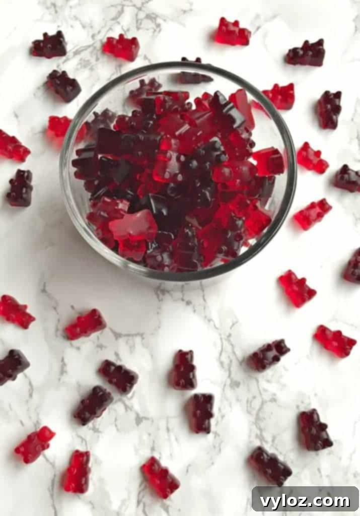 Close-up of wine gummy bears being demolded from silicone molds