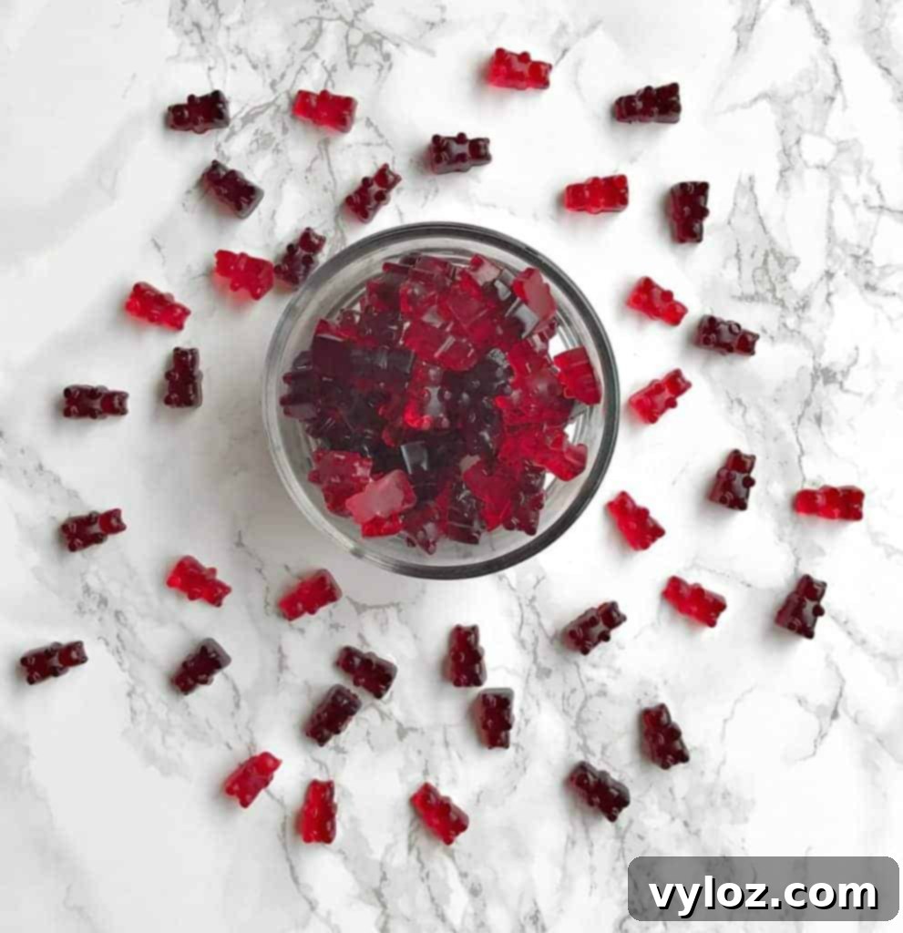 Delicious wine gummy bears arranged artfully on a serving dish with fresh berries