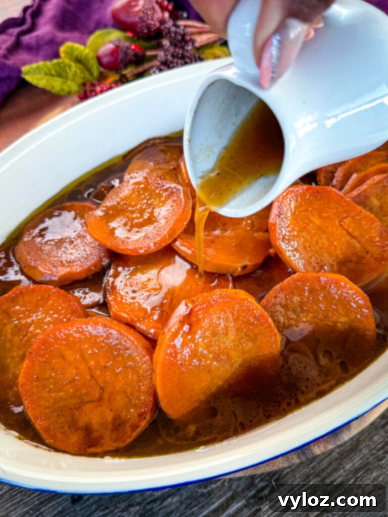 Mama's Easy Candied Sweet Potatoes 2 a spoonful of southern candied sweet potato yams in a baking dish