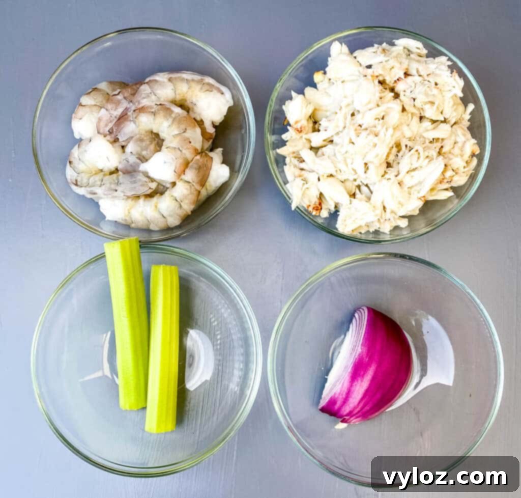 Effortless Crab Salad 3 raw shrimp, lump crab, raw celery, and raw onions in separate glass bowls