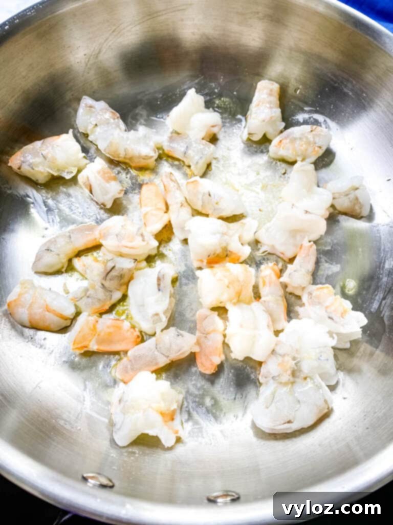 Effortless Crab Salad 6 raw shrimp in a frying pan