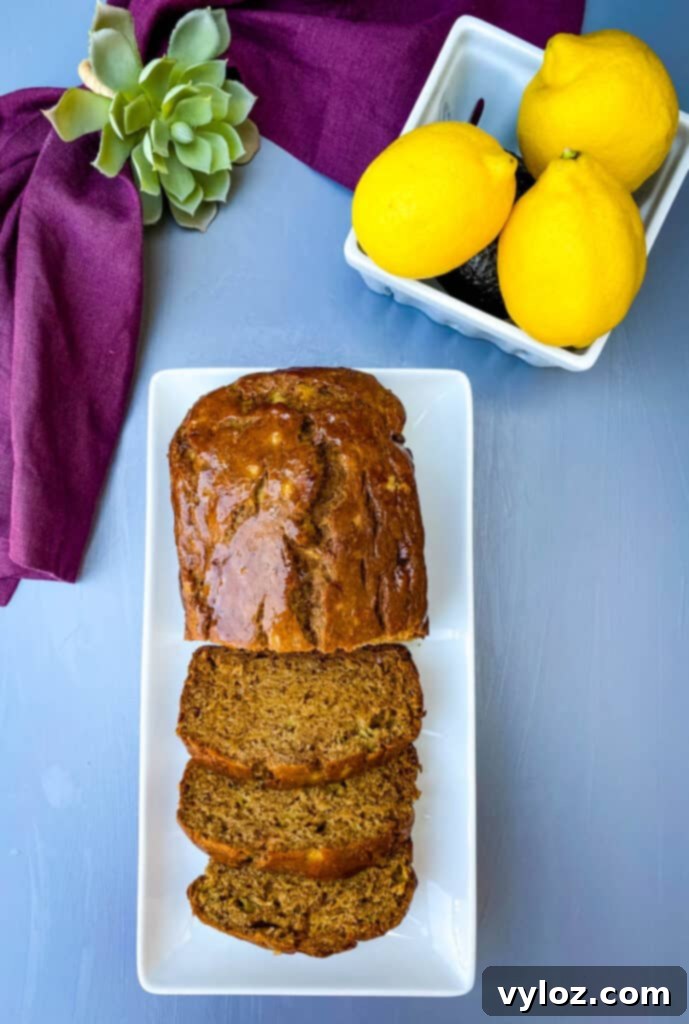 Close-up of healthy banana bread slices on a white plate, showcasing the moist interior and golden crust