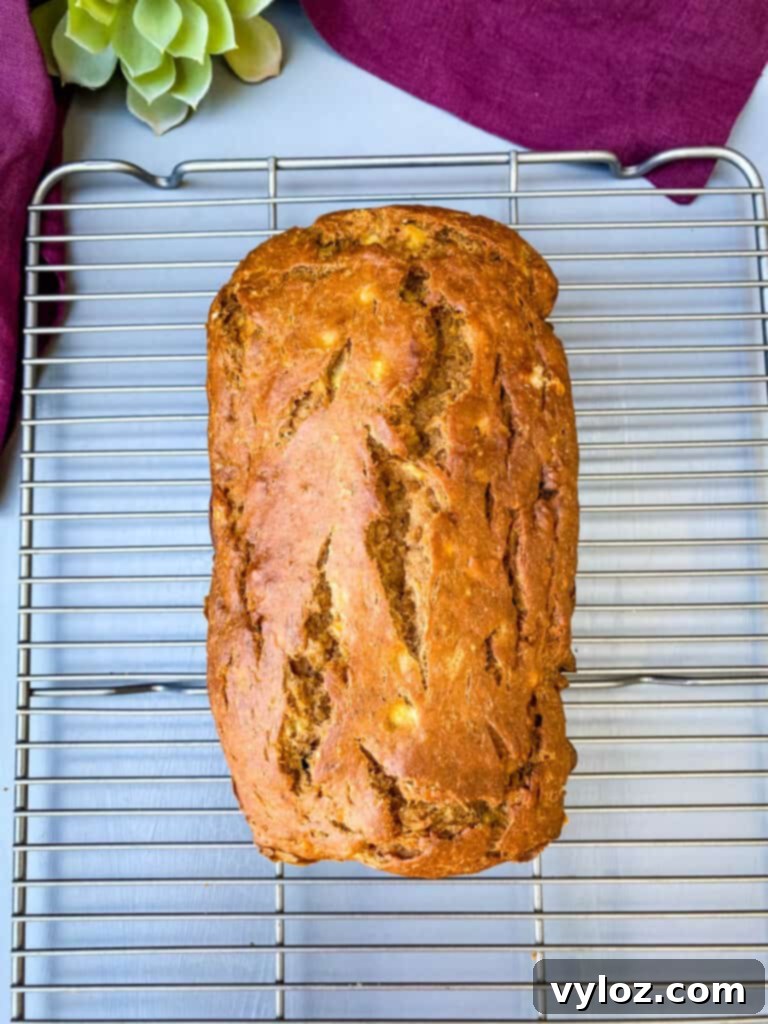Freshly baked healthy banana bread resting on a cooling rack