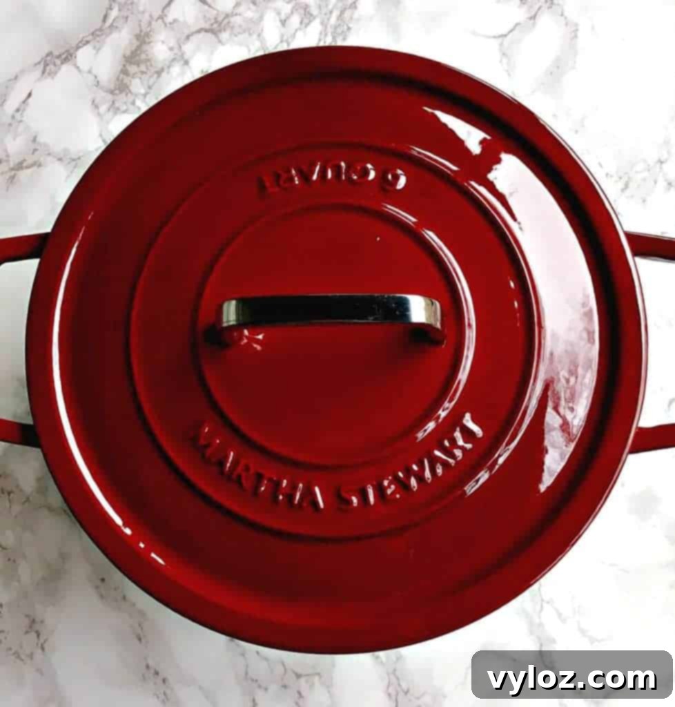 Delicious Dutch oven mashed potatoes ready to serve, garnished with herbs