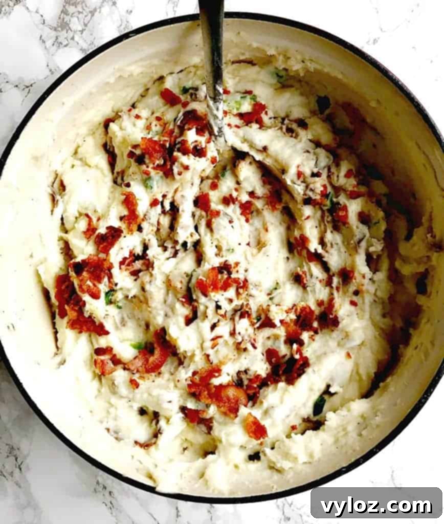 Large pot of freshly made Dutch oven mashed potatoes, ready for a gathering