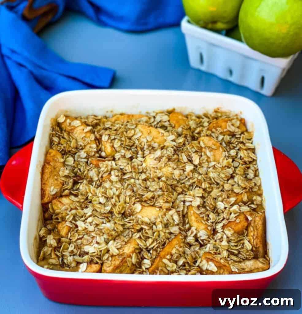 healthy apple crisp in a red baking dish